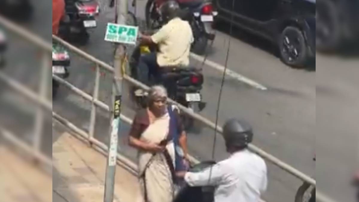 Elderly Woman Confronts Scooty Rider on Footpath in Kozhikode