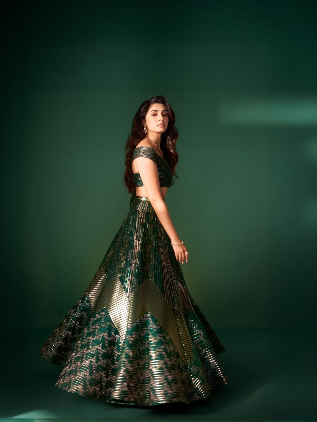 Krithi Shetty Shines in Metallic Green Gown with Elegant Gold Accents