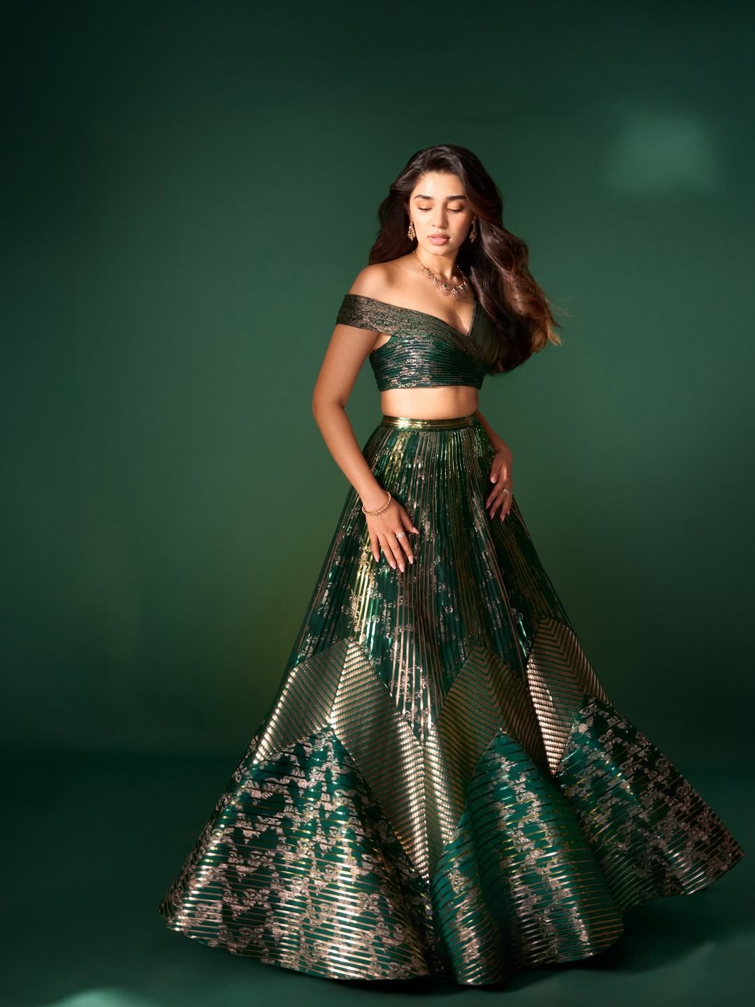 Krithi Shetty Shines in Metallic Green Gown with Elegant Gold Accents