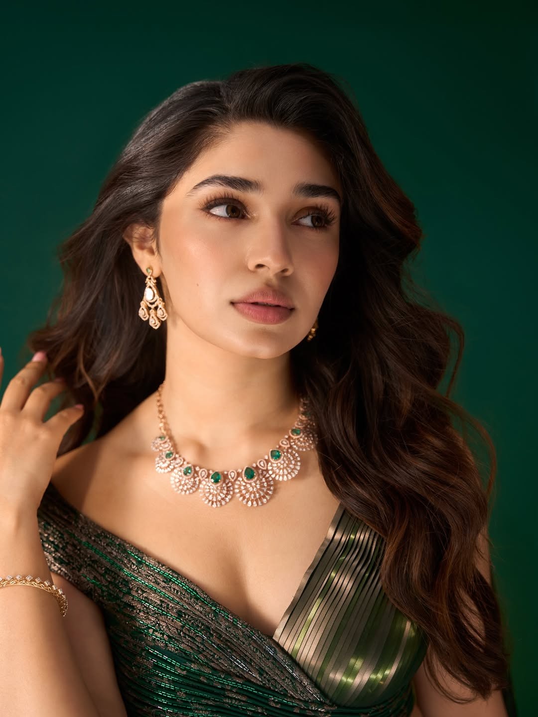 Krithi Shetty Shines in Metallic Green Gown with Elegant Gold Accents