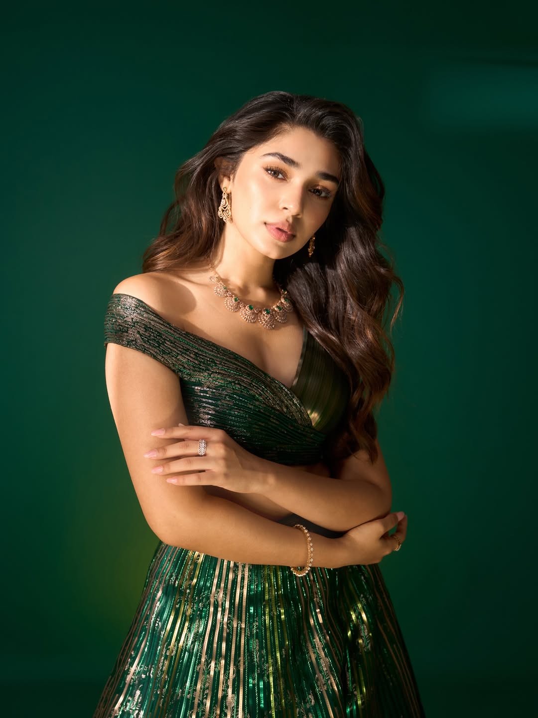 Krithi Shetty Shines in Metallic Green Gown with Elegant Gold Accents